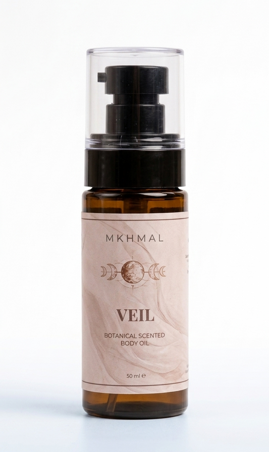 Bottle of MKHMAL Veil botanical scented body oil on a white background